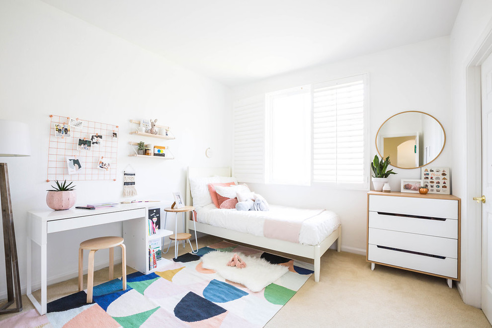 Inspiration for a small modern kids' room for girls in San Francisco with white walls, carpet and beige floor.
