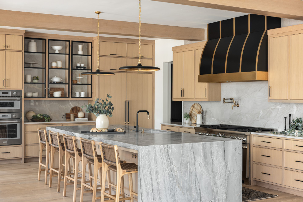 Inspiration for a transitional l-shaped eat-in kitchen in Orange County with an undermount sink, flat-panel cabinets, light wood cabinets, marble benchtops, multi-coloured splashback, marble splashback, panelled appliances, light hardwood floors, with island, beige floor, multi-coloured benchtop and exposed beam.