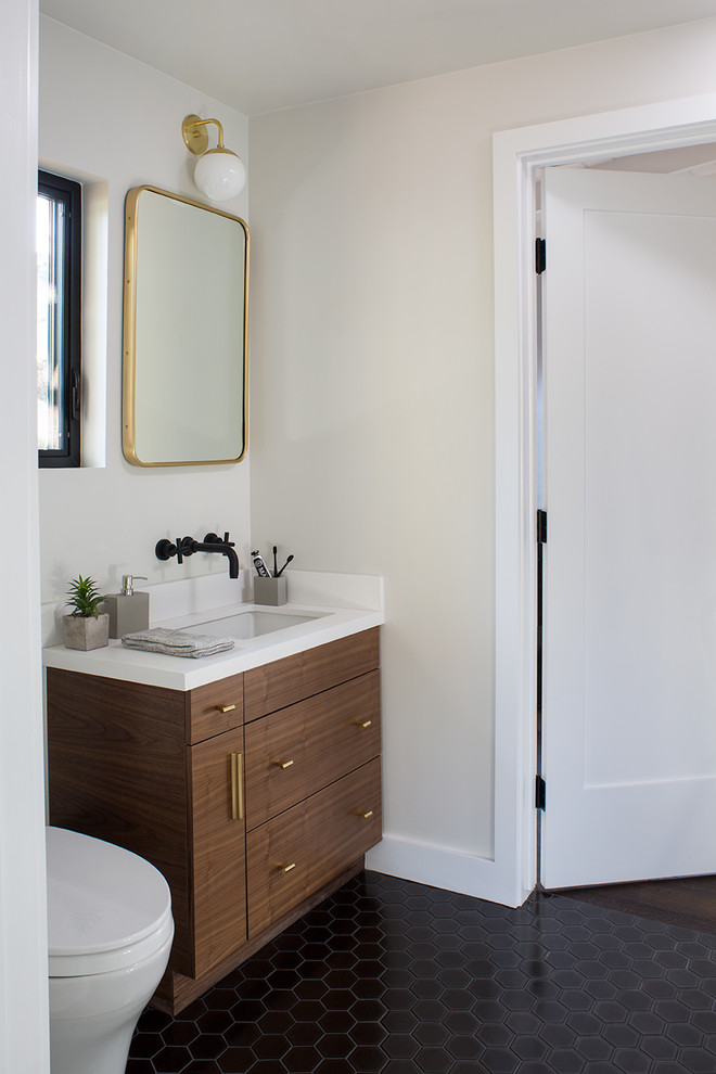 Inspiration for a small midcentury master bathroom in San Francisco with flat-panel cabinets, medium wood cabinets, a drop-in tub, an alcove shower, a one-piece toilet, blue tile, ceramic tile, green walls, porcelain floors, an undermount sink, engineered quartz benchtops, black floor, an open shower and white benchtops.