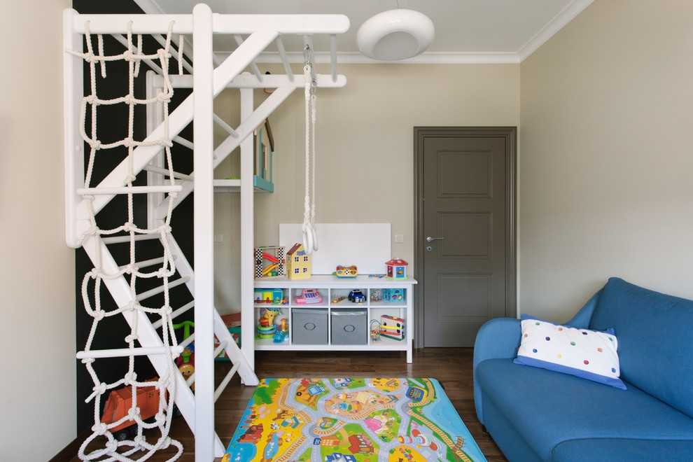 Contemporary gender-neutral kids' playroom in Moscow with beige walls, dark hardwood floors and brown floor.