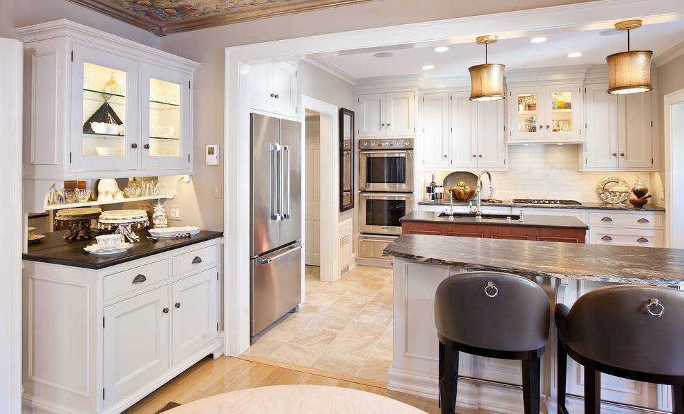 Kitchen - mid-sized transitional light wood floor kitchen idea with flat-panel cabinets, white cabinets, white backsplash, stainless steel appliances and an island