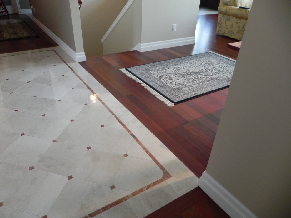 Photo of a large traditional foyer in Seattle with beige walls and medium hardwood floors.