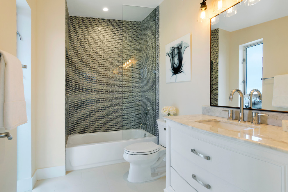 Mid-sized transitional 3/4 bathroom in Orange County with white cabinets, an alcove tub, a shower/bathtub combo, multi-coloured tile, mosaic tile, beige walls, concrete floors, an undermount sink, granite benchtops, white floor, an open shower and beige benchtops.