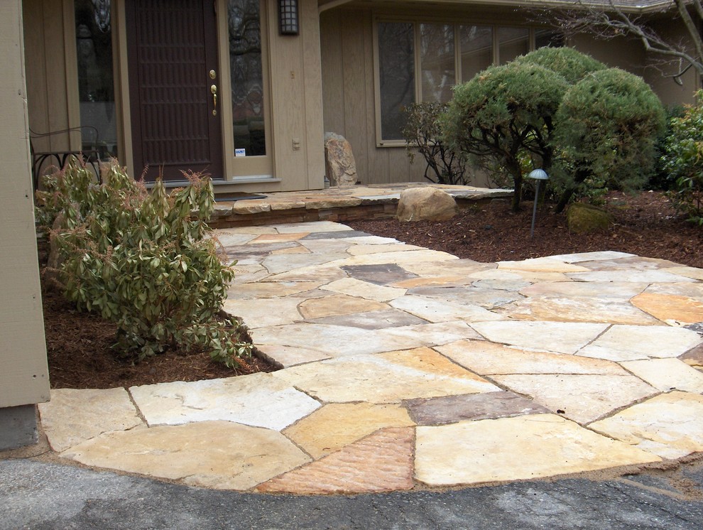 Design ideas for a mid-sized transitional front yard driveway in Boston with natural stone pavers and a garden path.