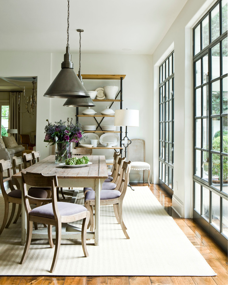 Inspiration for a country dining room in Atlanta with white walls and medium hardwood floors.