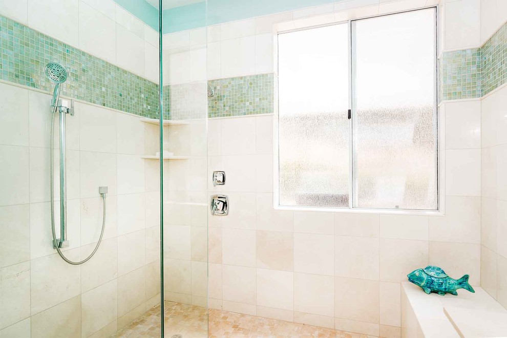 Photo of a small beach style master bathroom in Los Angeles with an undermount sink, flat-panel cabinets, white cabinets, marble benchtops, an alcove tub, an open shower, white tile, beige tile, green tile, blue walls, travertine floors, a two-piece toilet, porcelain tile, beige floor and an open shower.