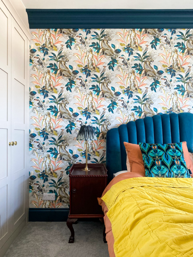 Design ideas for a medium sized eclectic master and grey and teal bedroom in London with multi-coloured walls, carpet, grey floors, wallpapered walls and a feature wall.