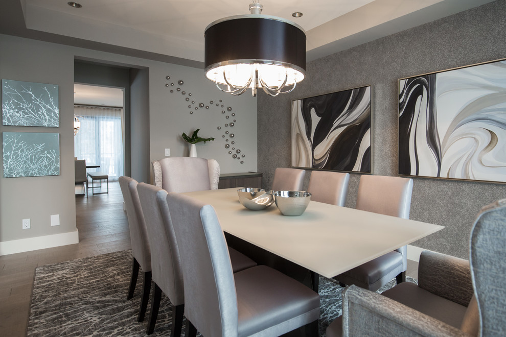 This is an example of a large contemporary separate dining room in Calgary with grey walls, light hardwood floors and grey floor.