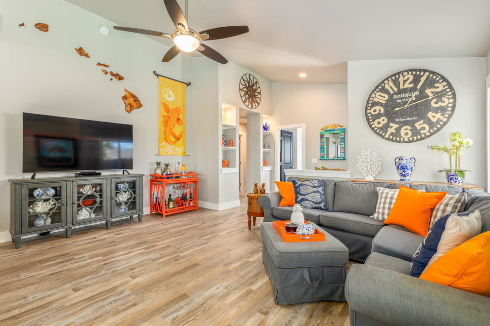 Photo of a beach style open concept living room in Hawaii with grey walls and vinyl floors.