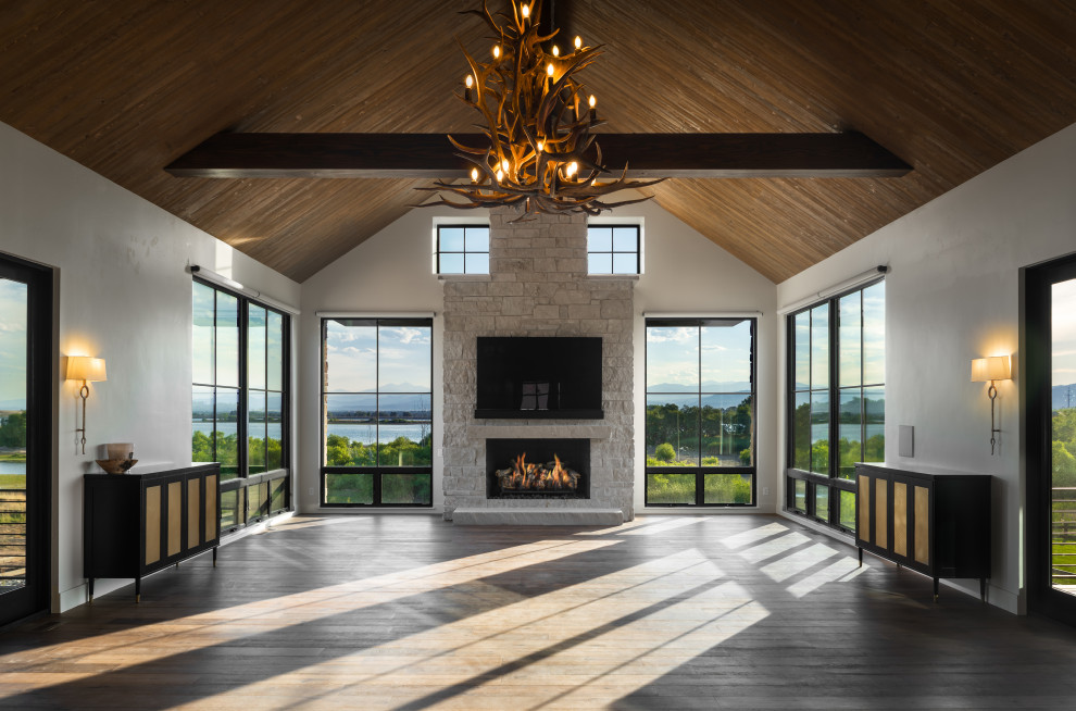 Inspiration for a modern formal open concept living room in Other with white walls, dark hardwood floors, a standard fireplace, a stone fireplace surround, a wall-mounted tv and brown floor.