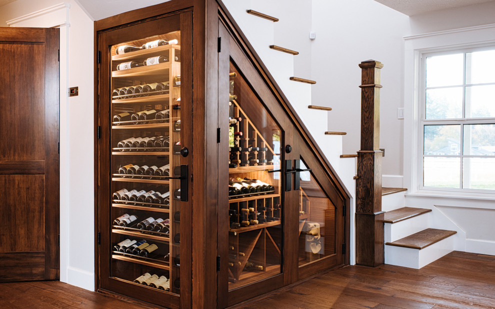 Small elegant dark wood floor wine cellar photo in Portland