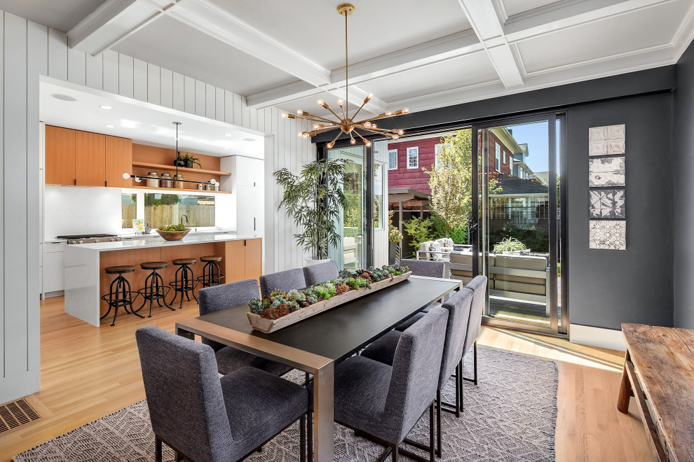 Great room - mid-sized contemporary light wood floor and coffered ceiling great room idea in Seattle with gray walls