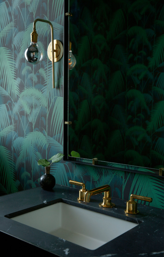 This is an example of a transitional powder room in Philadelphia with an undermount sink and green walls.