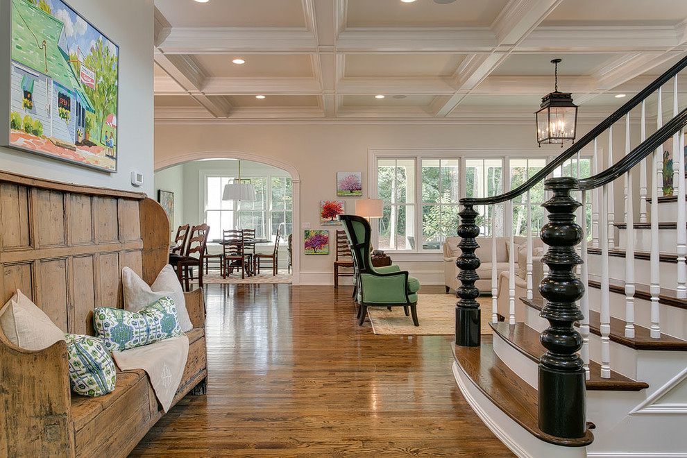 Photo of a mid-sized traditional foyer in Raleigh with green walls and medium hardwood floors.
