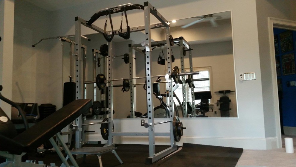Large traditional home weight room in Atlanta with grey walls and carpet.