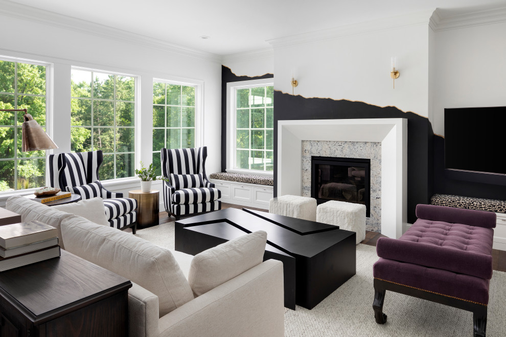 Photo of a contemporary living room in Minneapolis with multi-coloured walls, dark hardwood floors, a standard fireplace, a stone fireplace surround and brown floor.