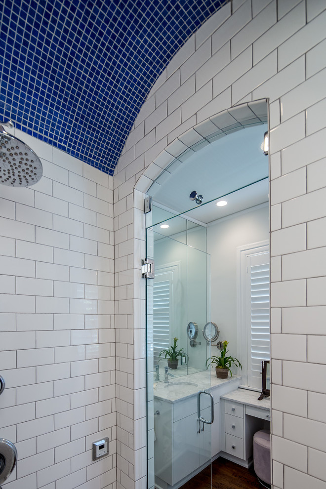 Inspiration for a large traditional master wet room bathroom in Atlanta with flat-panel cabinets, white cabinets, a corner tub, a two-piece toilet, white walls, dark hardwood floors, an undermount sink and engineered quartz benchtops.