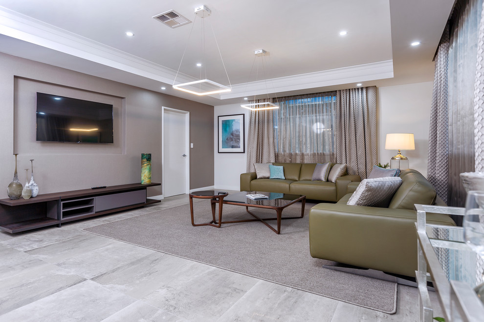 Mid-sized trendy open concept ceramic tile, beige floor and tray ceiling family room photo in Perth with beige walls and a wall-mounted tv