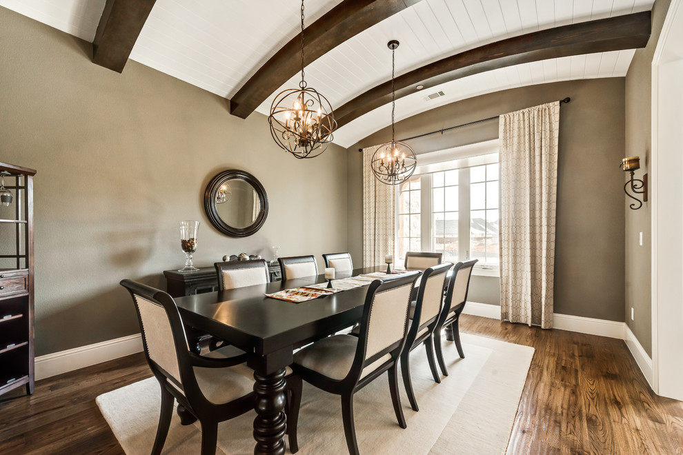 This is an example of a mid-sized transitional dining room in Dallas with grey walls and medium hardwood floors.