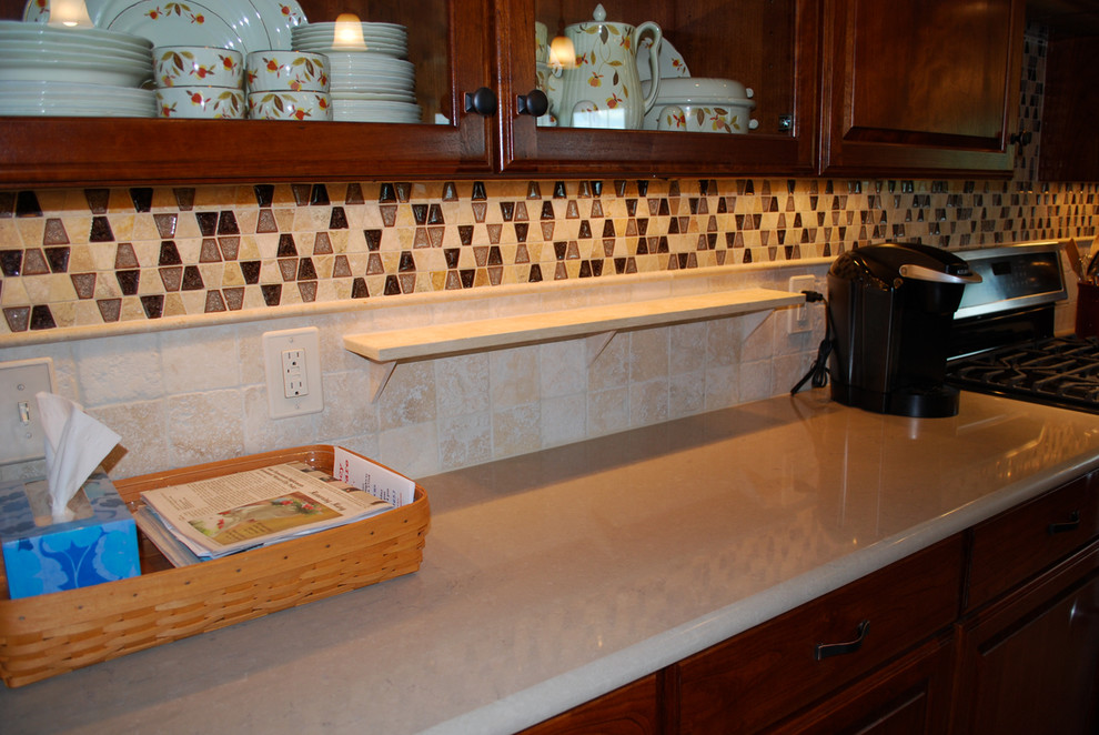 Kitchen photo in DC Metro with multicolored backsplash and travertine backsplash