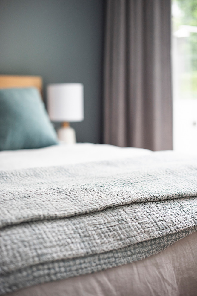 Mid-sized contemporary master bedroom in Sydney with white walls, porcelain floors, no fireplace and grey floor.