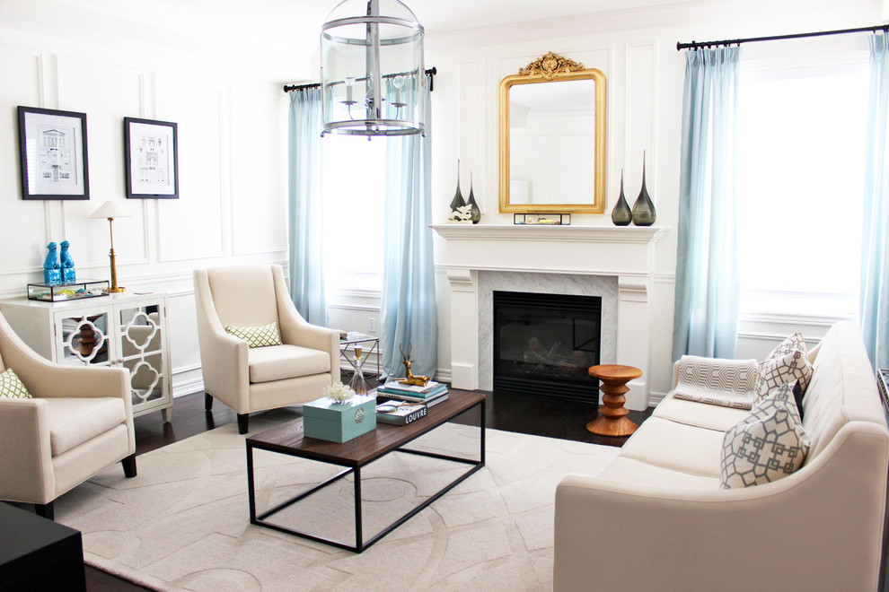 Photo of a transitional formal living room in Toronto with a standard fireplace.