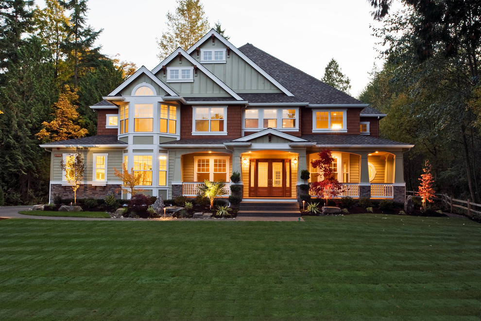 Design ideas for a large country two-storey green exterior in New York with vinyl siding and a gable roof.