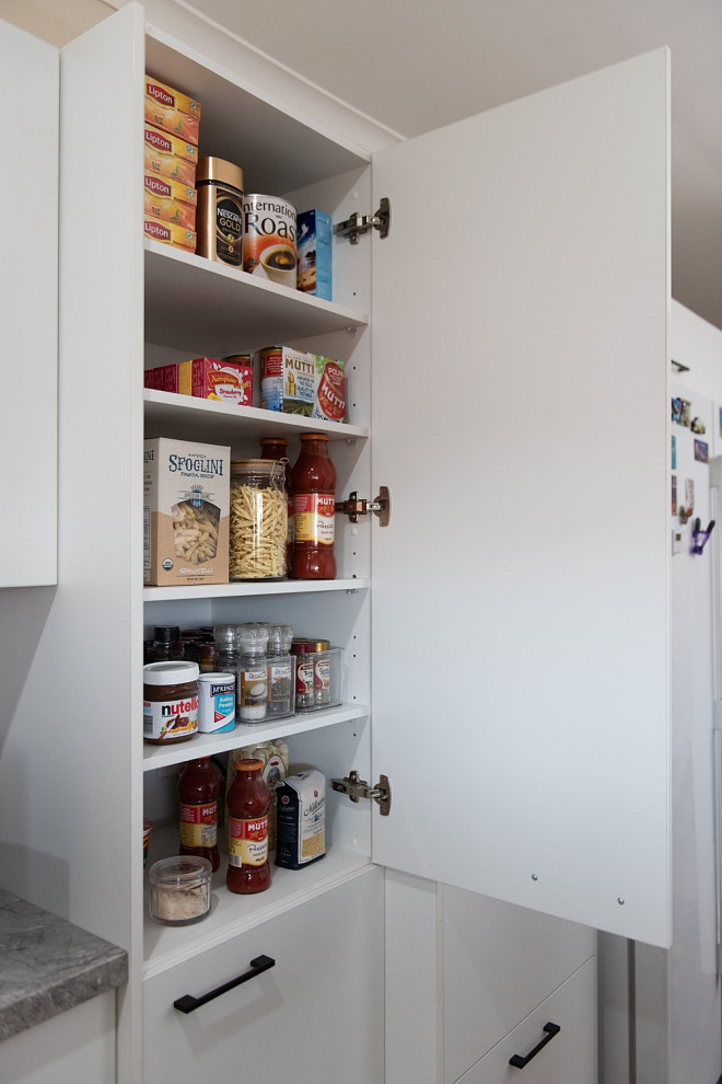 Photo of a small modern u-shaped kitchen pantry in Melbourne with a double-bowl sink, open cabinets, white cabinets, laminate benchtops, grey splashback, glass sheet splashback, stainless steel appliances, light hardwood floors, no island and grey benchtop.