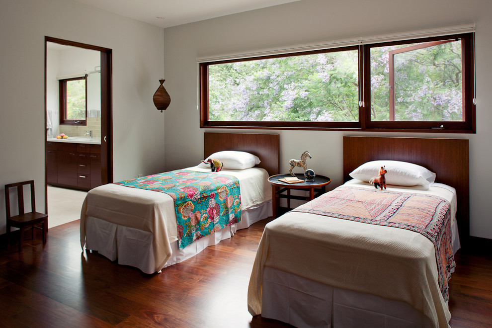 Contemporary guest bedroom in Los Angeles with medium hardwood floors.