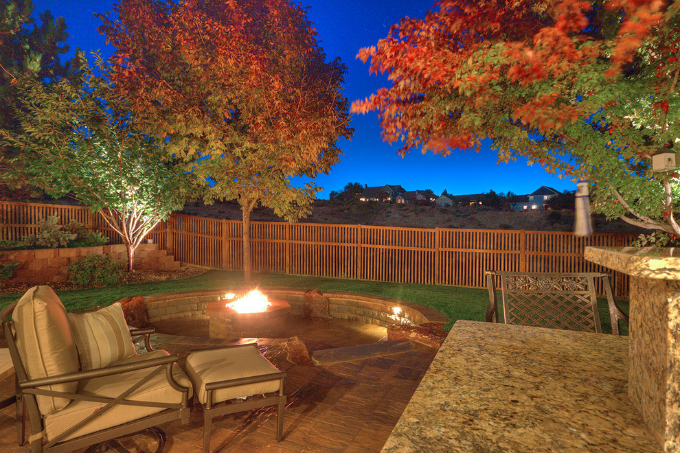 Design ideas for a large traditional backyard patio in Boise with a fire feature, concrete pavers and no cover.