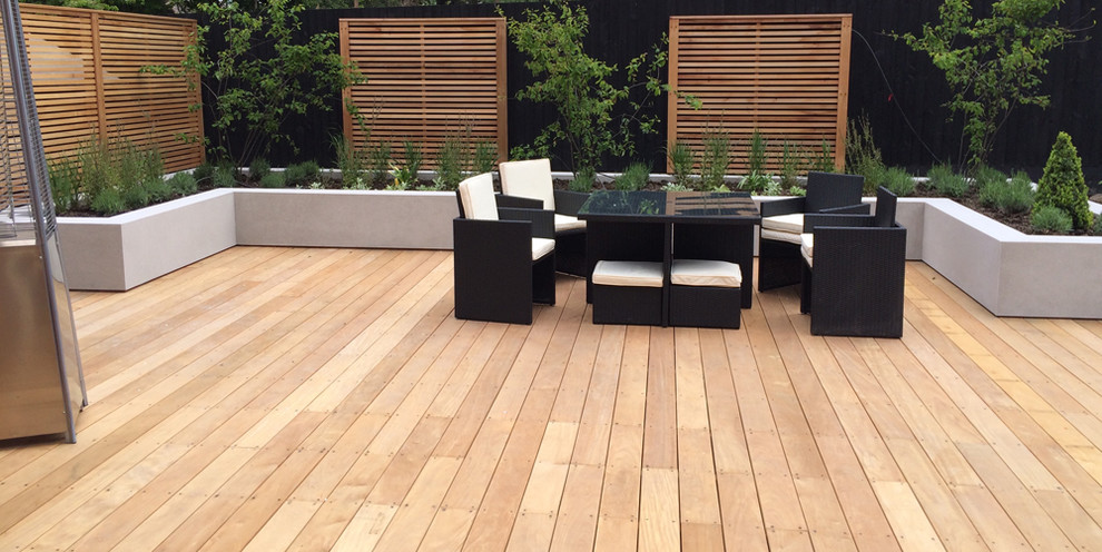 Inspiration for a large contemporary backyard patio in Cheshire with decking.