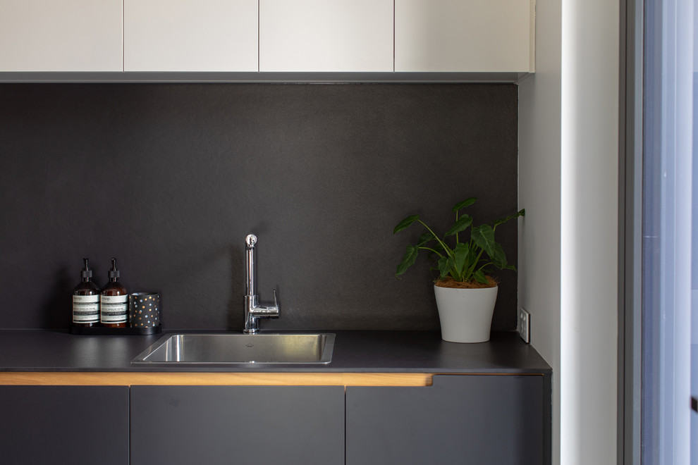 Large contemporary galley dedicated laundry room in Canberra - Queanbeyan.