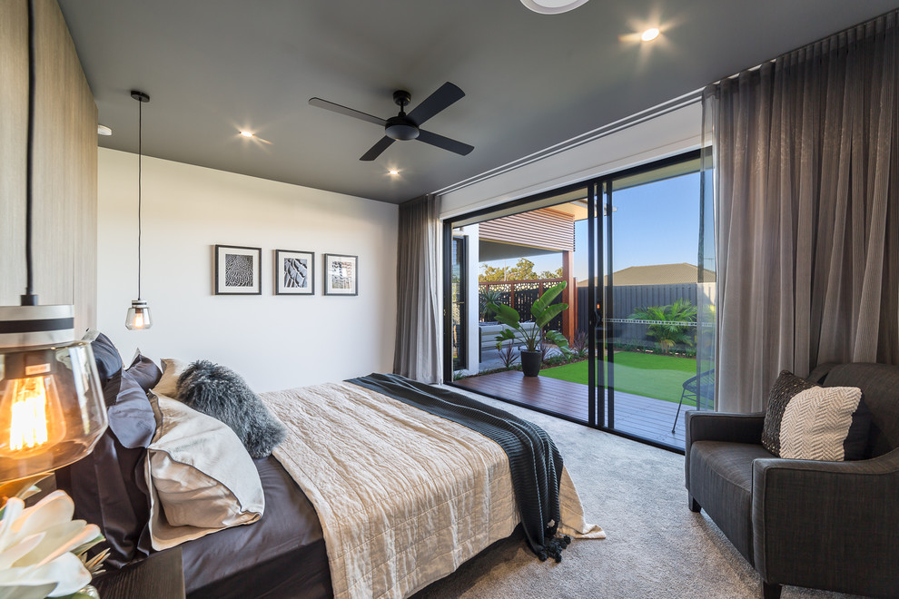 This is an example of an expansive contemporary master bedroom in Brisbane with white walls, carpet and grey floor.