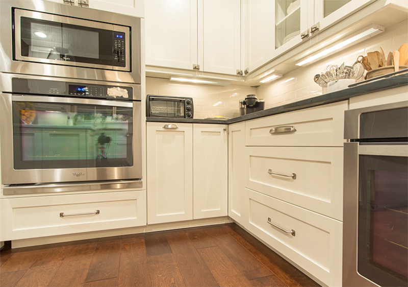 Transitional eat-in kitchen photo in Austin with shaker cabinets and white cabinets