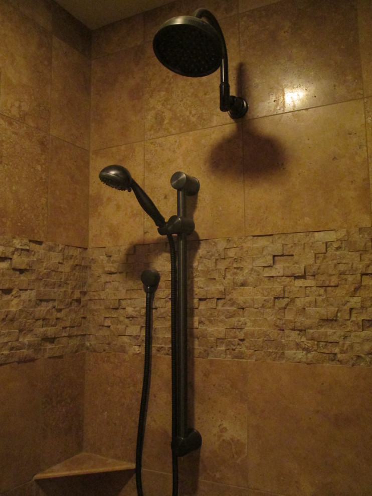 Walk-in shower - rustic multicolored tile and stone tile concrete floor walk-in shower idea in Phoenix with flat-panel cabinets, distressed cabinets, green walls, a vessel sink and granite countertops