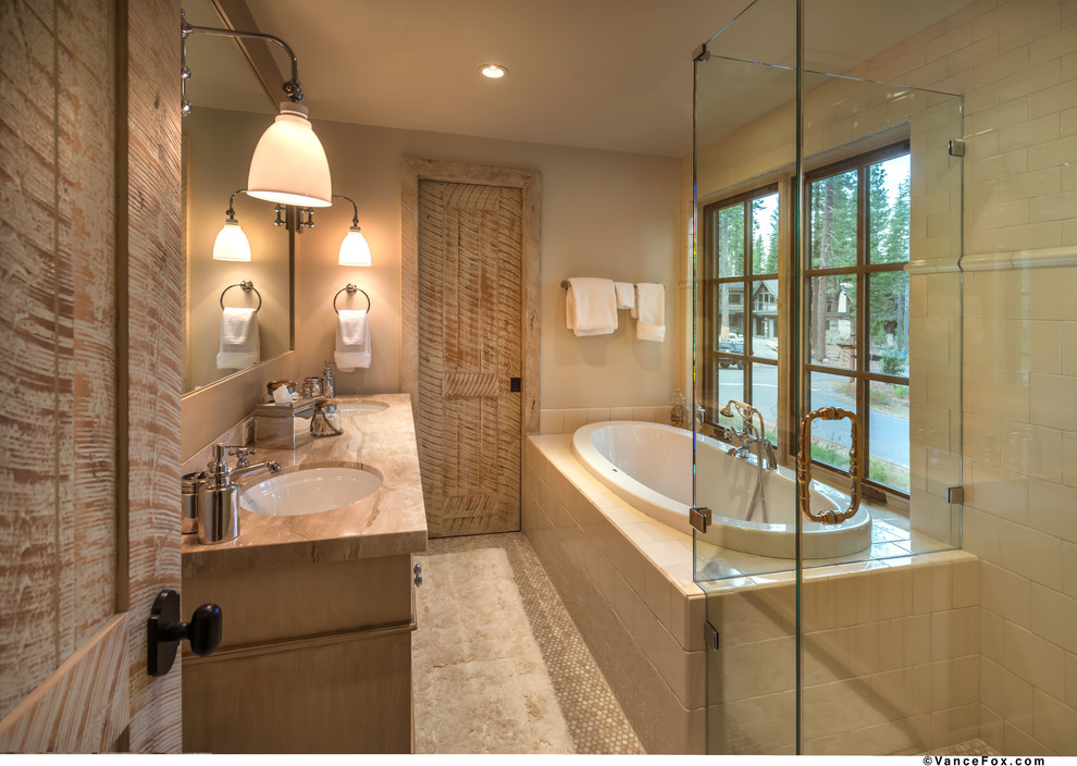 Mid-sized contemporary master bathroom in Sacramento with light wood cabinets, a drop-in tub, a corner shower, a two-piece toilet, beige walls, mosaic tile floors, an undermount sink and marble benchtops.