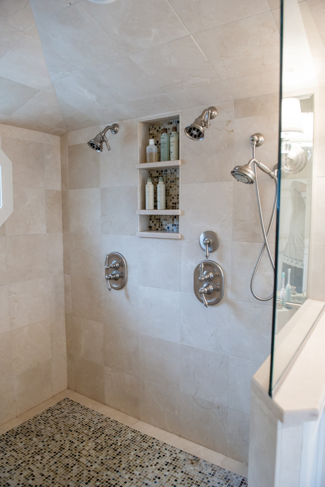 Photo of a large transitional master bathroom in Portland Maine with shaker cabinets, white cabinets, a corner shower, beige walls and ceramic floors.