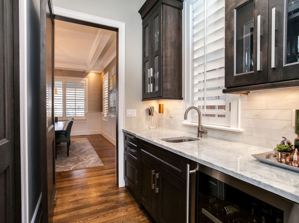 Inspiration for a mid-sized transitional eat-in kitchen remodel in Miami with an undermount sink and stainless steel appliances