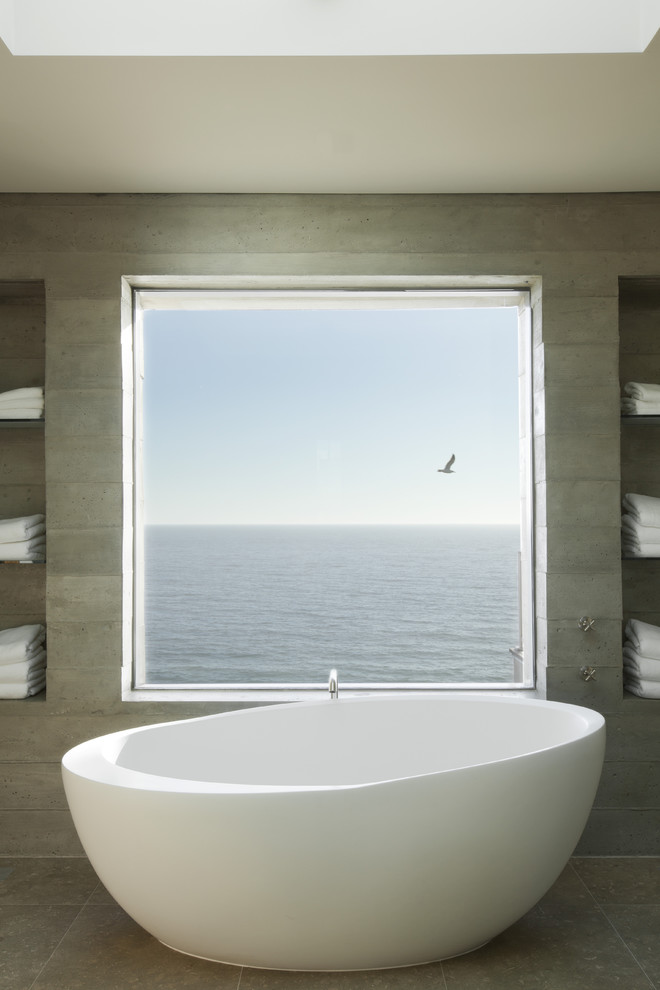 Design ideas for an industrial bathroom in Los Angeles with a freestanding tub.