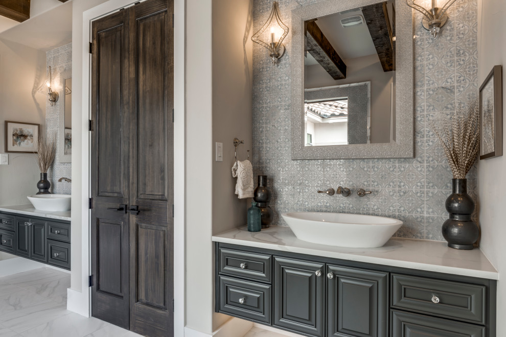 Expansive transitional master bathroom in Dallas with raised-panel cabinets, a freestanding tub, blue tile, marble, porcelain floors, a vessel sink, engineered quartz benchtops, white floor, white benchtops and a floating vanity.