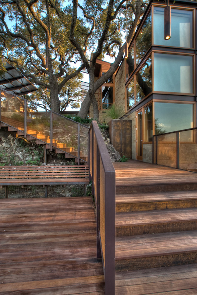 Photo of a large modern backyard deck in Austin with no cover.