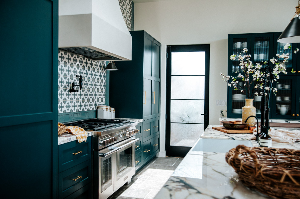 This is an example of a mid-sized contemporary single-wall kitchen pantry in Los Angeles with turquoise cabinets, marble benchtops, green splashback, ceramic splashback, stainless steel appliances and with island.