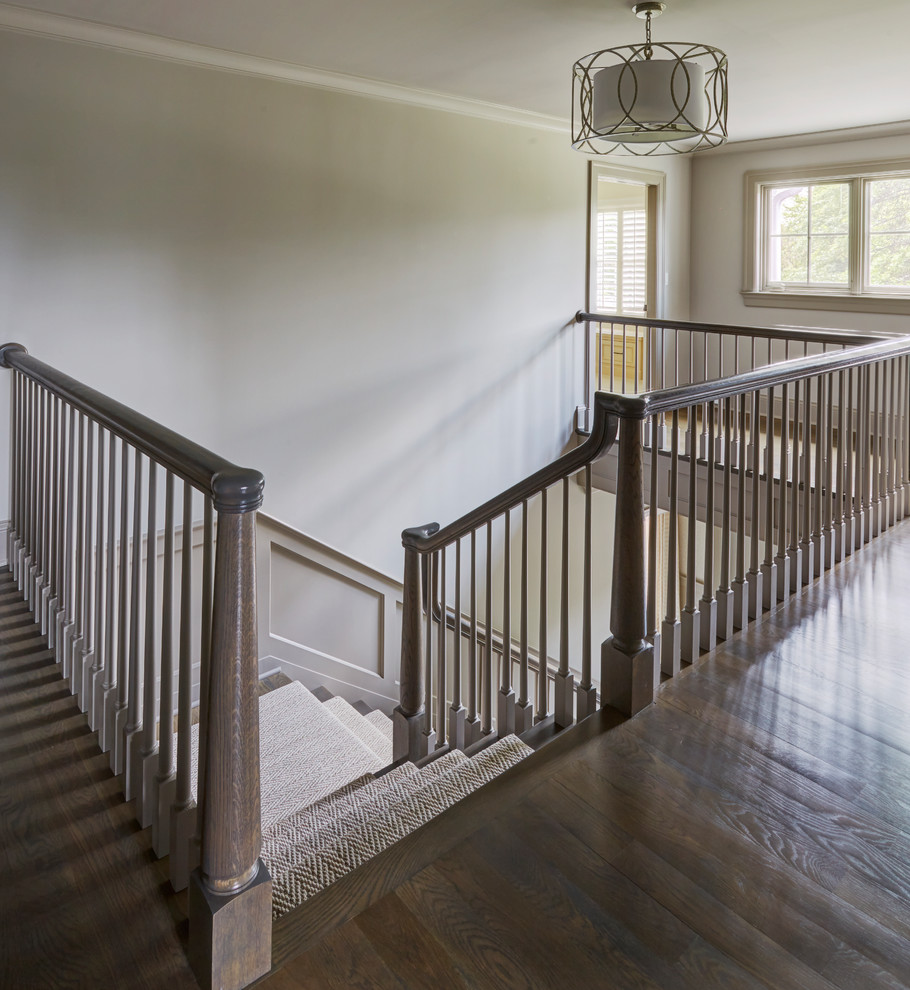 Inspiration for a large transitional dark wood floor hallway remodel with beige walls