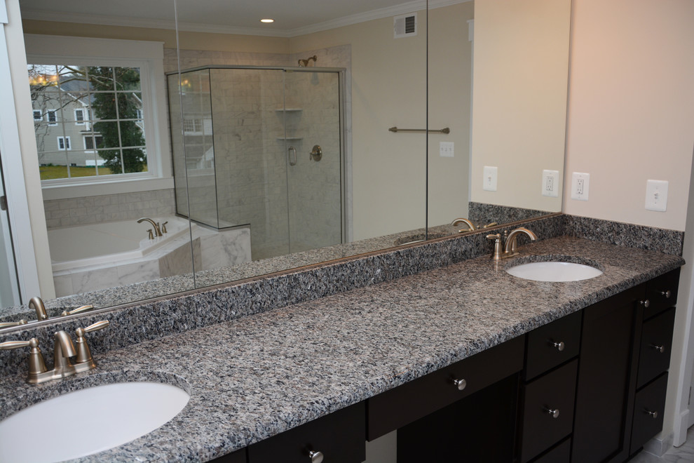 Double shower - large transitional master white tile marble floor double shower idea in Baltimore with recessed-panel cabinets, dark wood cabinets, a hot tub, a two-piece toilet, white walls, an undermount sink and granite countertops