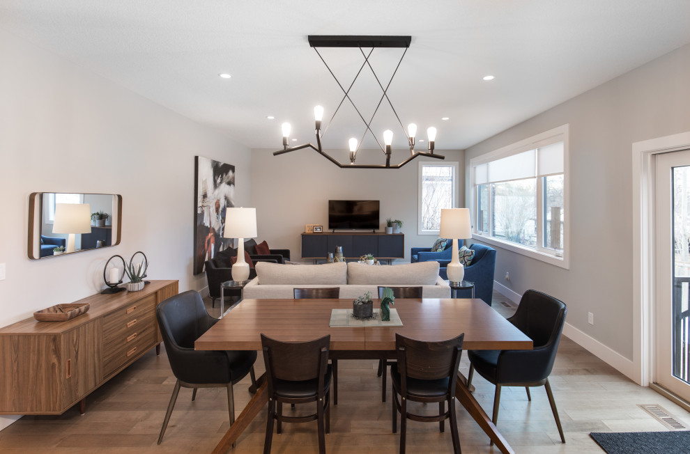 Great room - mid-sized transitional light wood floor and brown floor great room idea in Calgary with no fireplace