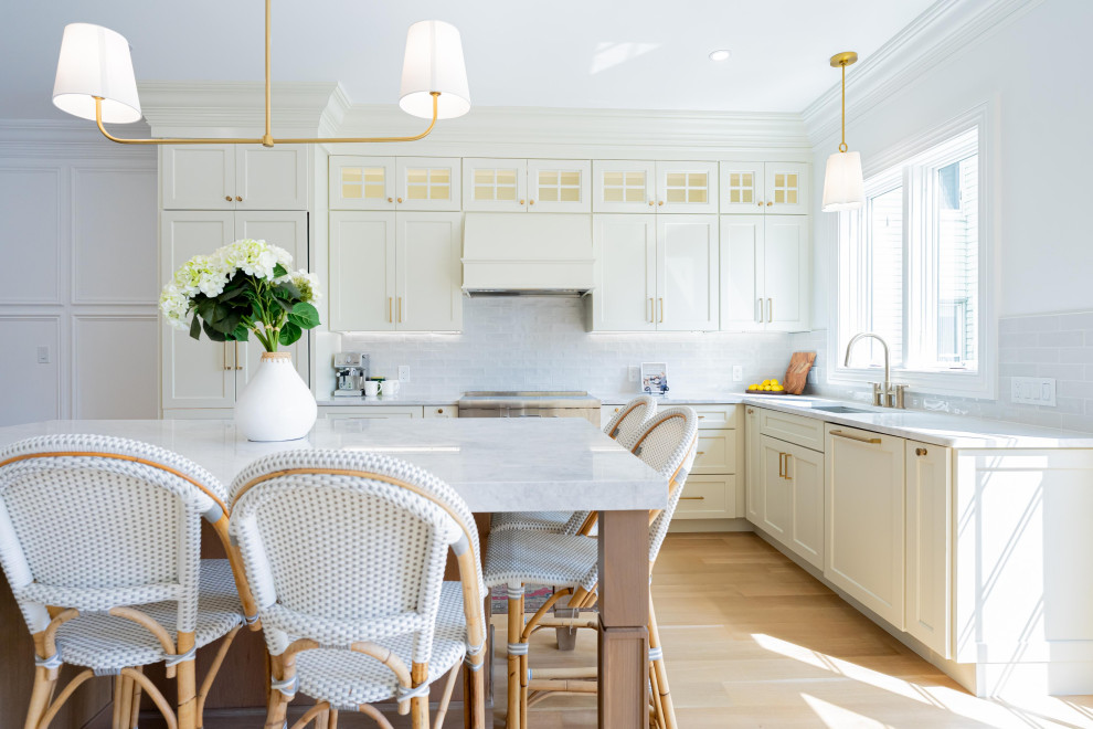 Transitional kitchen photo with recessed-panel cabinets and white cabinets