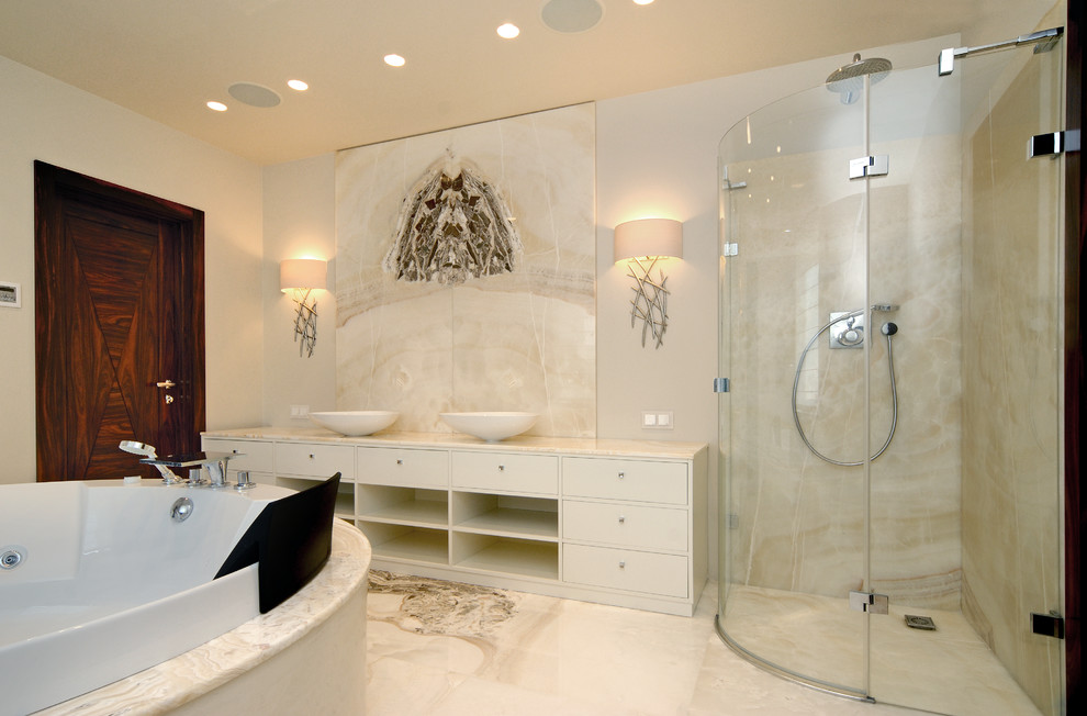 Inspiration for an expansive traditional 3/4 bathroom in Moscow with furniture-like cabinets, beige cabinets, an undermount tub, an open shower, a wall-mount toilet, beige tile, marble, beige walls, marble floors, a vessel sink, onyx benchtops, beige floor, a hinged shower door and white benchtops.