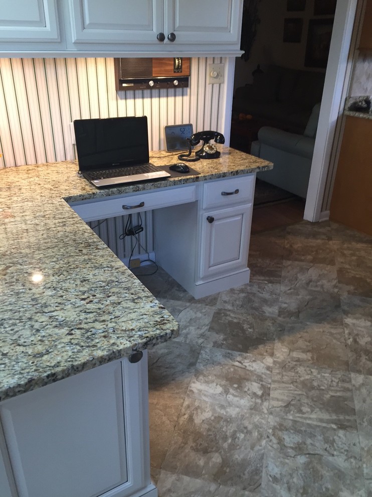 Inspiration for a small transitional l-shaped eat-in kitchen remodel with raised-panel cabinets, beige cabinets, granite countertops and a peninsula