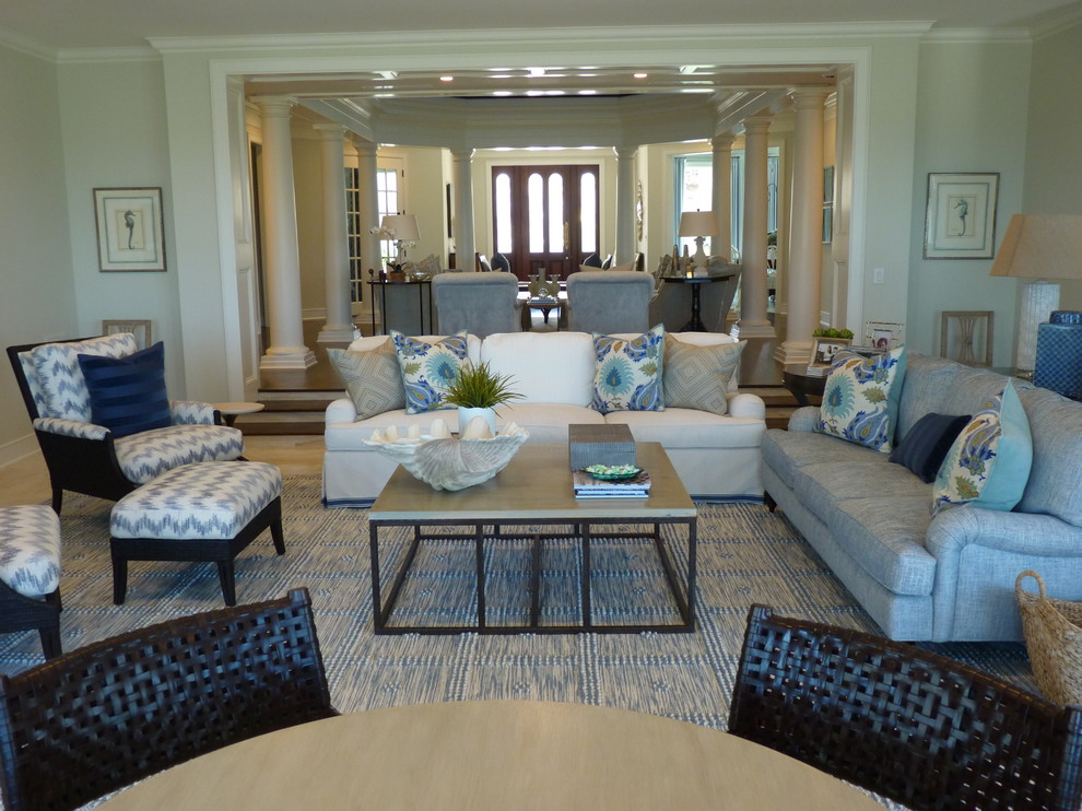 Large beach style open concept family room in Jacksonville with white walls.