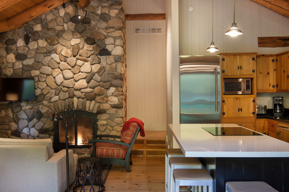 Inspiration for a mid-sized rustic l-shaped light wood floor eat-in kitchen remodel with an undermount sink, louvered cabinets, light wood cabinets, stainless steel appliances and an island